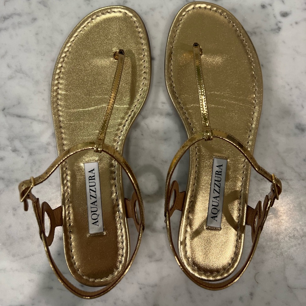 Aquazzura “Barely There” Metallic Gold T-Strap Leather Sandals
